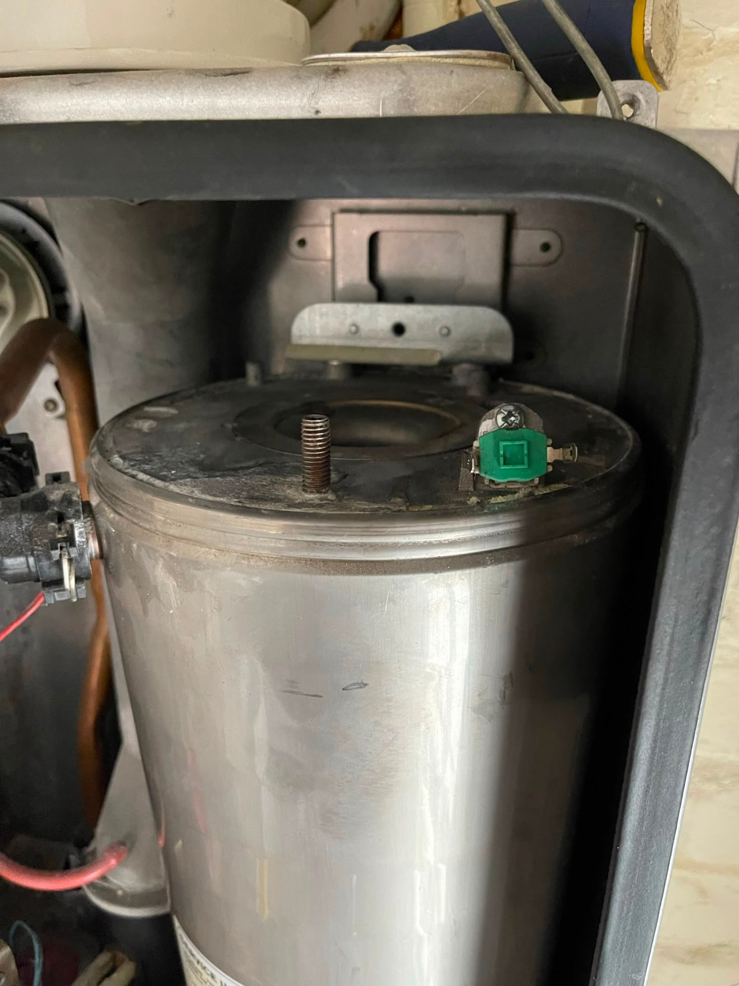 Immersion heater element and thermostat fitted to a stainless steel hot water cylinder, fitted by Gas Safe registered engineers in Essex
